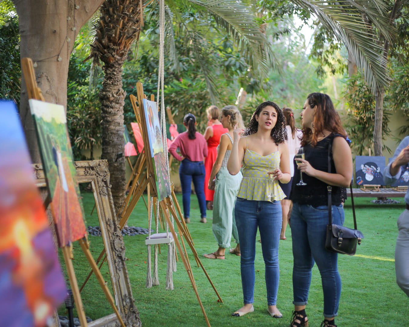 We Love Art Exhibition at The Garden Project showing student artwork from painting courses in Dubai